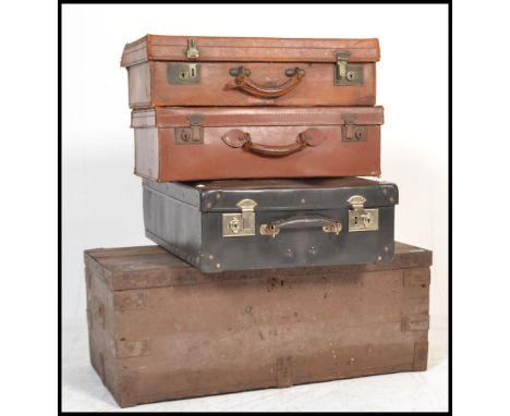 A stack of vintage suitcases to include 2 leather examples, a black vinyl case and&nbsp; a wooden 19th century tool chest wit