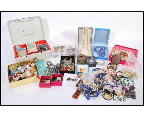 A large collection of costume jewellery to include chains and necklace pendants, brooches, pearls, earrings, rings, dress wat