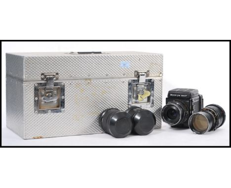 A Mamiya RB 67 professional S camera in a metal flight case with a 250mm lens No.11196 and a 90mm len No. 131423, a Mamiya 82
