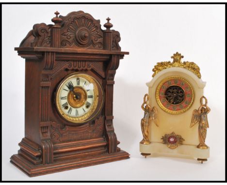 An early 20th Century American Ansonia Clock Company of New York oak two train architectural mantel clock. Roman numeral chap