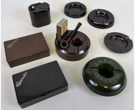 A quantity of smoking related Bakelite accessories, including brown and black cigarette boxes, a green Cords Segments ashtray