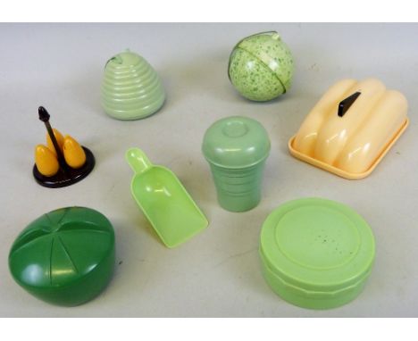 A quantity of Bakelite to include; a vintage 20th century Art Deco green cocktail shaker by Quick Mix Major of stepped conica