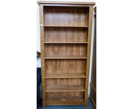 A modern oak tall open shelf unit, 98cm wide, 200cm high