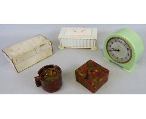 A boxed Stadium smoker's Bakelite set, comprising cigarette box and set of six identical stacking ashtrays of heavily mottled