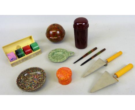 A quantity of Bakelite to include; four boxed Art Deco napkin rings with urea-formaldehyde colours, a pair of Catalin plastic