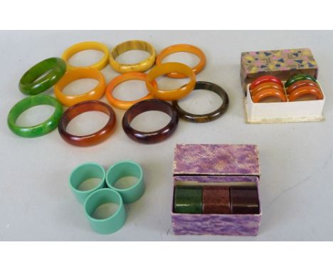 A quantity of Bakelite to include; eleven coloured urea-formaldehyde bangles/bracelets, a box of six smaller examples, three 