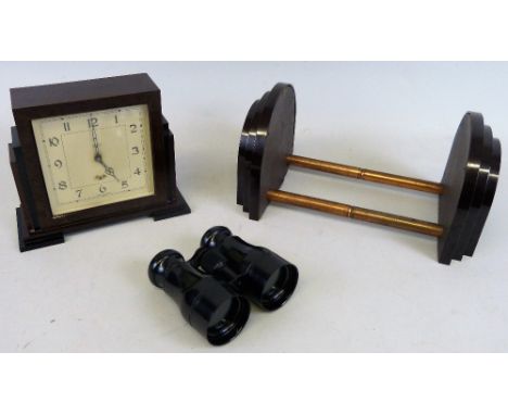 A Smiths Bakelite cased mantel clock, a pair of Bakelite binoculars and an extendable bookrack (3)