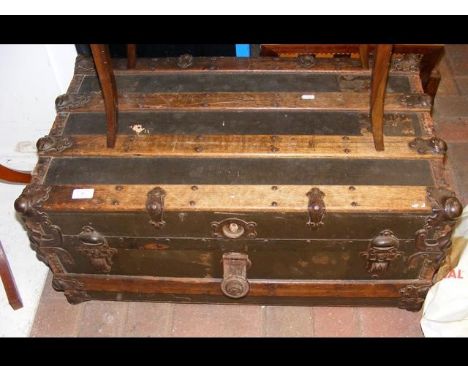 A wooden bound travelling trunk 