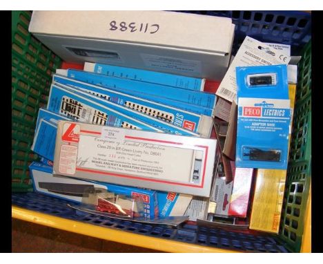 A plastic container with model railway kits, track, etc. 