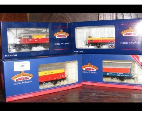 A boxed Bachmann box van, together with three others and a Heljan hopper 