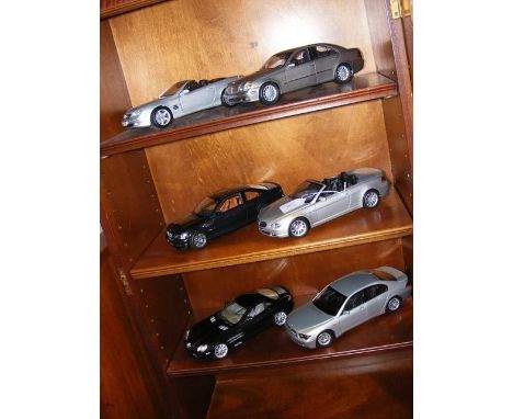 Six model cars including a Kyosho BMW 7 series