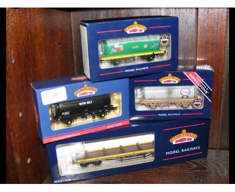 A boxed Bachmann tank wagon, together with three others  
