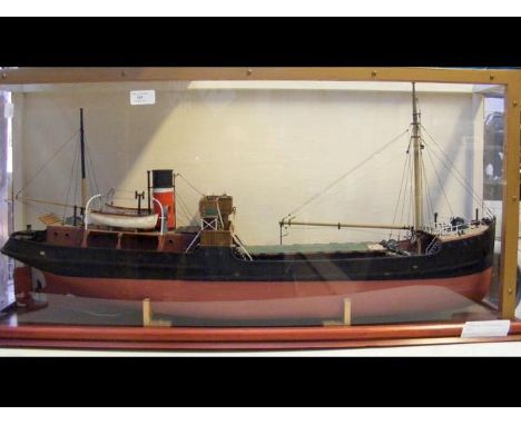 A scratch built 'live' model steamboat, having a glazed display case and radio control system - the coastal steamer measuring