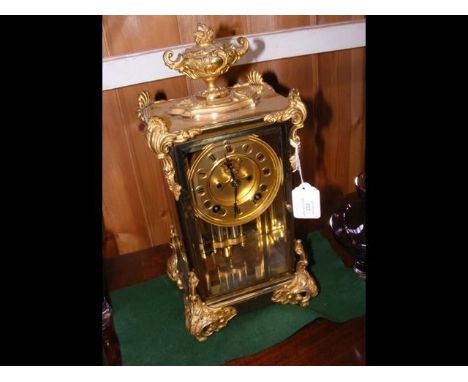An elegant ormolu four glass mantel clock - 38cm high - with visible escapement CONDITION REPORTglass and case okwinds and ru