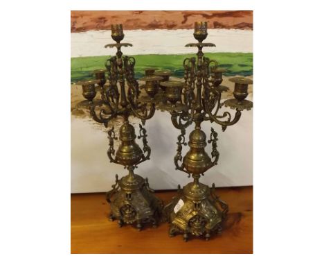 Pair of early 20th century brass five light candelabra of ornate form 