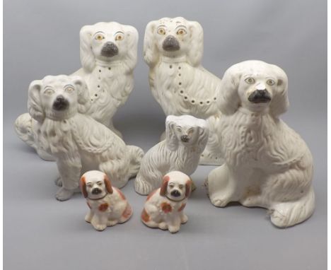 Mixed Lot: seven various 19th century Staffordshire model dogs, largest 11" high 