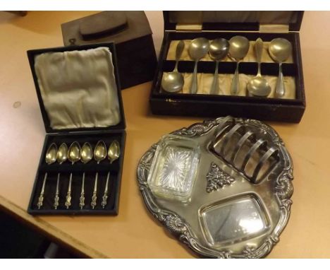 Mixed Lot: silver plated combination toast rack and butter dish, cased cutlery and a metal tea caddy box 