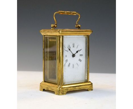 Brass carriage clock having white enamel dial with Roman numerals   Condition: 