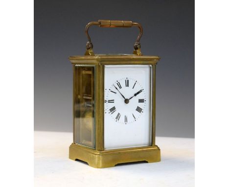 Brass carriage clock, the white enamel dial having Roman numerals   Condition: 
