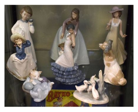 Eight various Nao porcelain figures   Condition: 