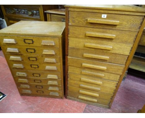 TWO VINTAGE OAK DOCUMENT CHESTS of ten and eight drawers with wooden handles, 113 and 90 cms high respectively