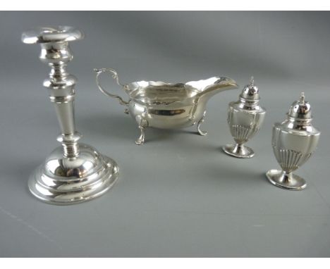 A GEORGE II SILVER SAUCE BOAT, two Victorian silver pepper pots and an Edward VII silver candlestick, Newcastle, indistinct d