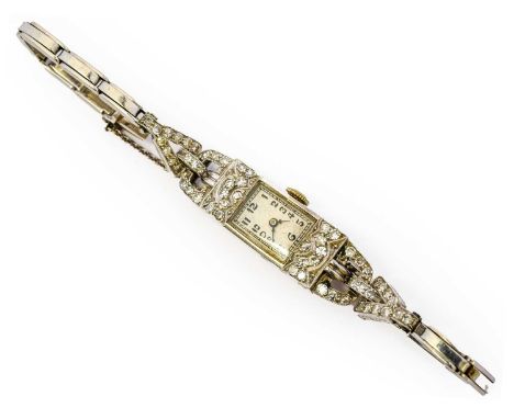 A lady's diamond cocktail wristwatch, circa 1930, mechanical movement, the rectangular dial with arabic numerals with stirrup