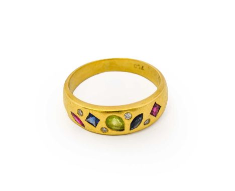 A synthetic ruby, synthetic sapphire, peridot and diamond ring, the yellow plain polished band inset with marquise and calibr