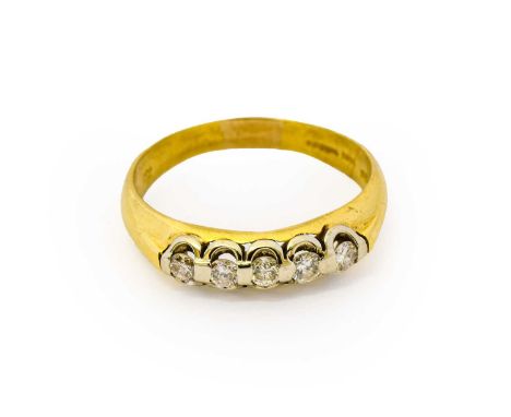 An 18 carat gold diamond five stone ring, the round brilliant cut diamonds in white claw settings, to a yellow plain polished