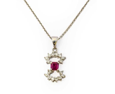 A ruby and diamond pendant on chain, the bow motif formed of an emerald-cut ruby and round brilliant cut diamonds, in white c