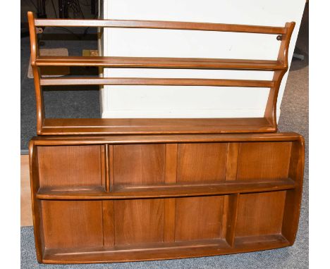 An Ercol elm two-tier open plate rack and an Ercol elm two-tier plate rack with paneled back 107cm by 50cm (2)