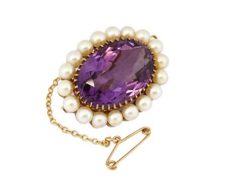 A 9 carat gold amethyst and cultured pearl brooch, the oval cut amethyst within a border of cultured pearls, in a yellow claw