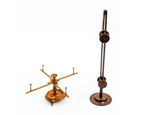 19th Century walnut wool winder, with four each with a turned bobbin holder, on a circular base and three splayed walnut feet