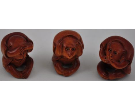 Three netsuke hardwood carvings of monkeys, see no evil, hear no evil, speak no evil