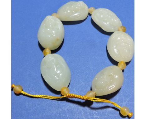A Chinese Jade bead bracelet, beads in the form of laughing Buddhas 