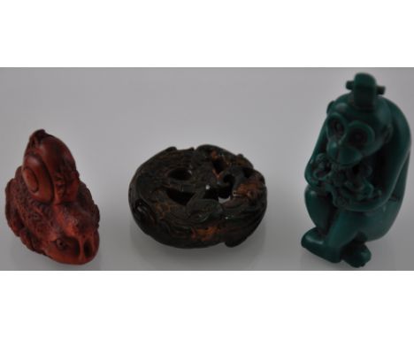Three assorted carvings, a wooden toad with a snail, together with a monkey snuff bottle and a jade coloured dragon with a ra