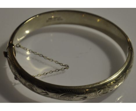 A hallmarked silver bangle (English) half chase bangle 