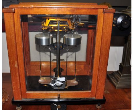 A pair of electronic balance scales in glazed cabinet by Stanton Instruments of London