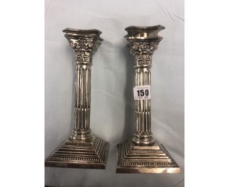 A pair of cast corinthumn column hm silver candlesticks Birmingham 1932 weight 490 grams 