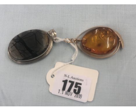 A Russian yellow metal and amber pendant and a hallmarked silver and agate pendant
