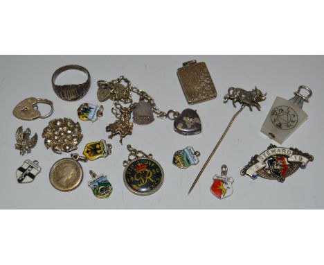 A silver coloured metal book shaped locket pendant; a Masonic pendant; silver and enamel charms; etc