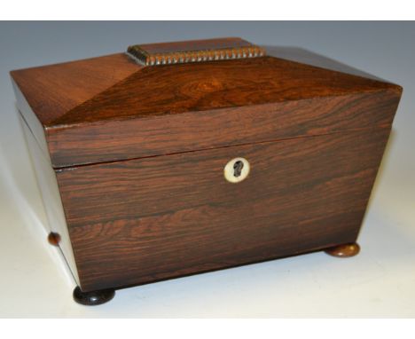 A Victorian rosewood sarcophagus tea caddy, hinged cover enclosing a pair of lidded compartments, c.1850