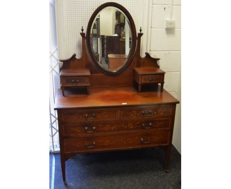 A Edwardian inlaid mahogany dressing table, oval mirror and two short drawers to superstructure, two short drawers over two l