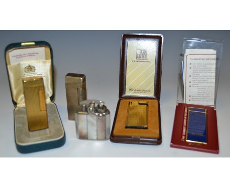 Pocket Lighters - a Dunhill silver plated cased 726982 lighter;  another gold plated with ridged case, boxed;  other Colibri,