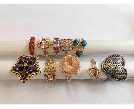 A collection of ten silver and gold plated silver dress rings some set with gemstones, including fire opal, turquoise, amethy