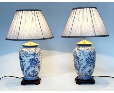 TABLE LAMPS, a pair, Chinese ceramic blue and white toile print, of vase form with wooden bases and shades, 64cm H. (2) 