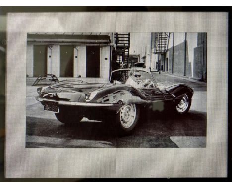 'STEVE MCQUEEN IN HIS JAGUAR', photographic print, framed and glazed, 63cm x 83cm. 