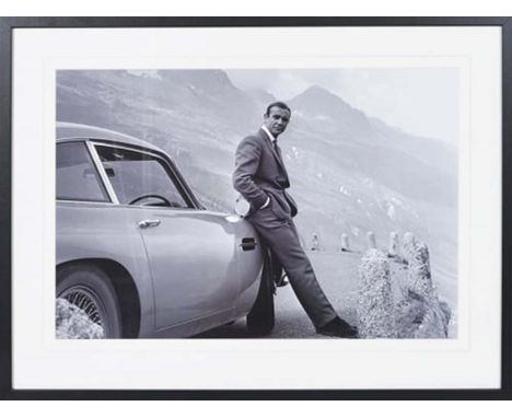 SEAN CONNERY AS JAMES BOND WITH ASTON MARTIN, photographic print, framed, 63cm x 83cm. 