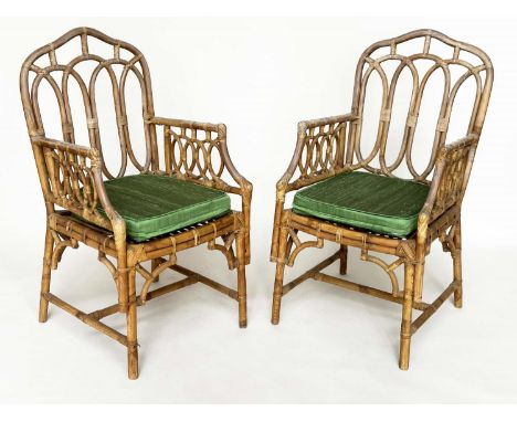 CONSERVATORY ARMCHAIRS, a pair, vintage bamboo, rattan framed and cane bound with Gothic arched backs and silk seat cushion ,