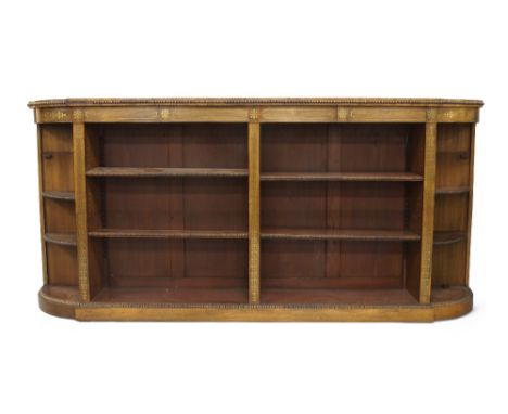 A Regency rosewood credenza, brass inlaid with four drawers above open adjustable shelves, flanked by rounded shelves, raised